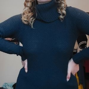 A blue turtleneck sweater